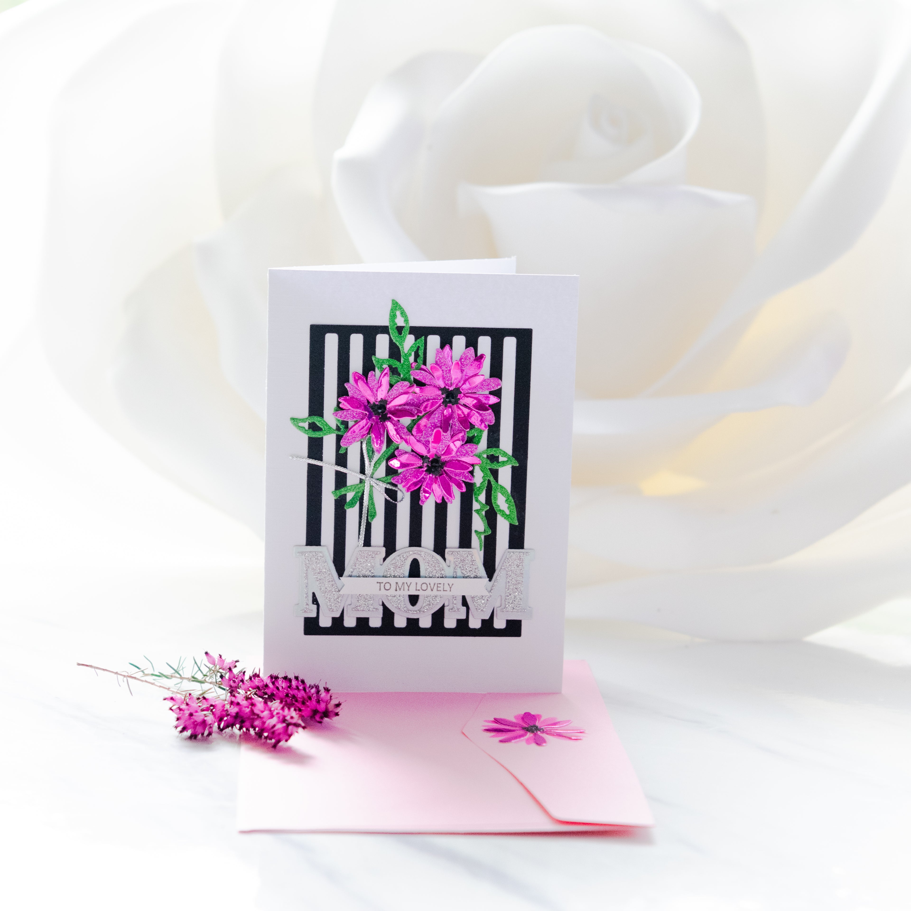 Mother's day handmade artisan card with the word to my lovely mom with 3 pink handmade flowers and matching envelope